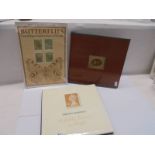 A Queen Elizabeth II portrait in stamps book, a 1987 Royal Mail stamp book and butterfly stamps.