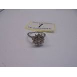 A three quarter carat white gold floral diamond ring, size N, 2.75 grams.