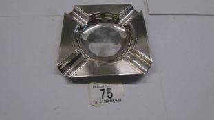A silver ashtray hallmarked for Birmingham, 80 grams.