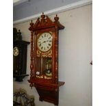 An early 20th century mahogany wall clock in working order, COLLECT ONLY.