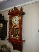 An early 20th century mahogany wall clock in working order, COLLECT ONLY.