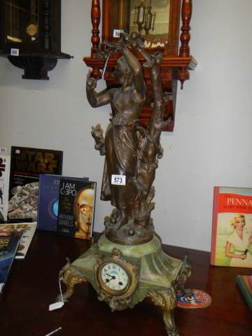 A late Victorian mantle clock surmounted female figure and with enamel dial, COLLECT ONLY.