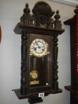 An early 20th century mahogany Vienna wall clock in working order, COLLECT ONLY.
