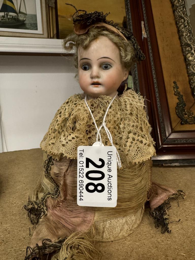 A 19th century German porcelain musical doll, AM10/OXDEP. 3200, not working.