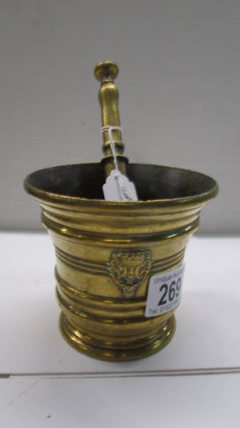A brass pestle and mortar