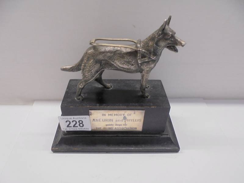 A vintage Guide Dogs for the Blind trophy of a Labrador.