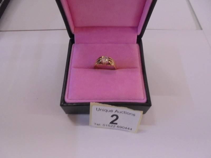 A half carat diamond ring tests as 18ct gold, size N, 5.5 grams.