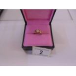 A half carat diamond ring tests as 18ct gold, size N, 5.5 grams.