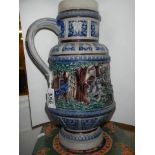 A 20th century ceramic jug featuring battle scenes.