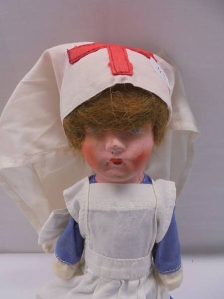 A vintage cloth nurse doll. - Image 2 of 2