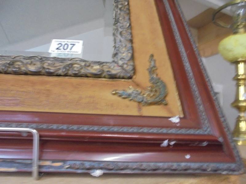 A Bevel edged mirror in a wood and metal frame. COLLECT ONLY. - Image 2 of 2