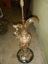 A tall spelter ewer with cherub handles converted in to a lamp, COLLECT ONLY.