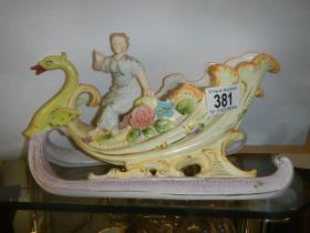 A porcelain cabinet piece of a swan carriage.