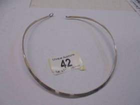 A silver neck collar.