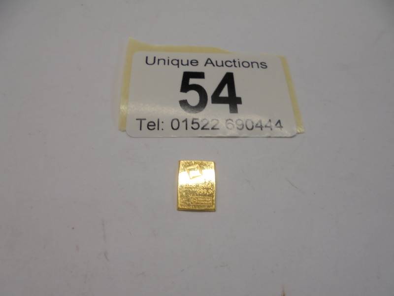 A 1 gram fine gold bar, (24 carat).