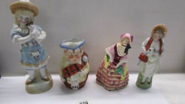 Three ceramic figures and a Toby jug.
