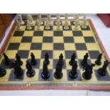 A chess set complete with board.