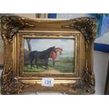 A gilt framed study of horses,