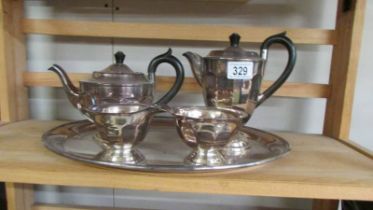A four piece silver plate teaset with tray.