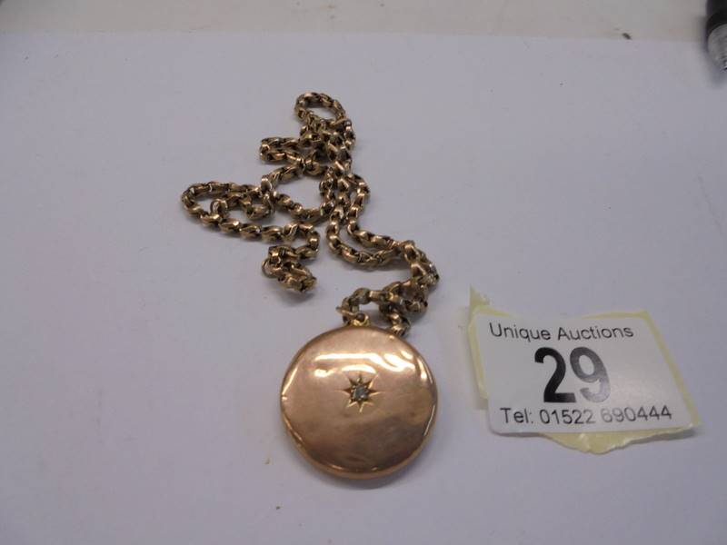A 9ct gold locket on a 9ct gold chain, 15.8 grams.