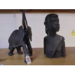 A tribal female bust and an elephant figure.