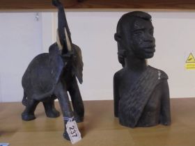 A tribal female bust and an elephant figure.