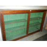 A good glazed sliding door book case, COLLECT ONLY.