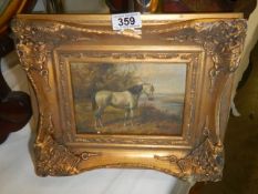A gilt framed study of a horse.
