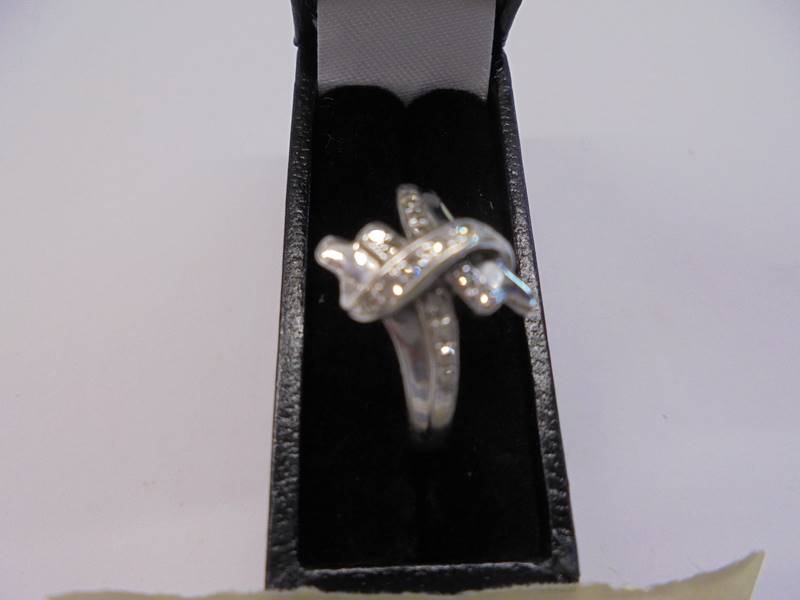 A diamond set twist ring in a 9ct gold shank, size L, 2.2 grams. - Image 2 of 3