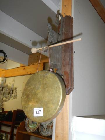 An early 20th century wall hanging brass dinner gong.