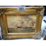 A gilt framed study of a sailing ship.