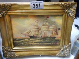 A gilt framed study of a sailing ship.