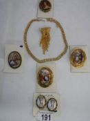 A mixed lot of costume jewellery including brooches.