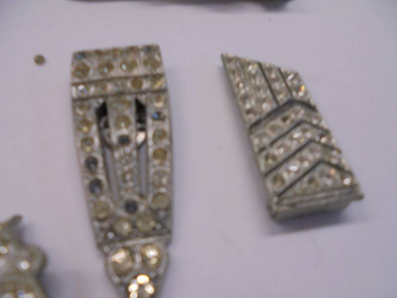 A quantity of paste clips and brooches, art deco in white metal, one stamped 'Kutiklip, ten in total - Image 5 of 6