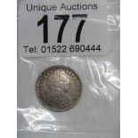 A 1702 Maundy four pence coin.