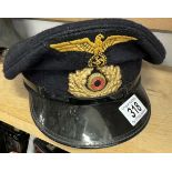A WW2 German naval cap (possibly replica).