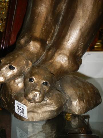 A sculpture of otters fishing. - Image 2 of 2