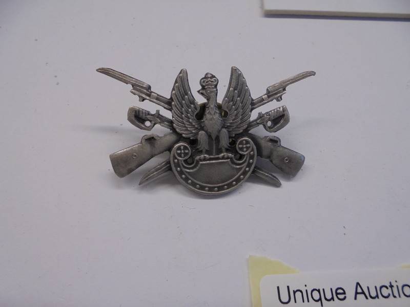 An eagle badge and one other. - Image 4 of 5