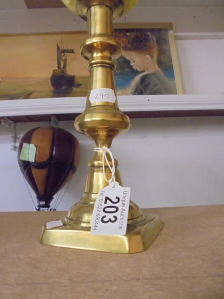 A 19th century brass drop in font candlestick oil lamp with yellow glass font and chimney. - Image 2 of 3