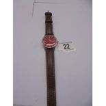 A vintage Omega Automatic Seamaster gent's wrist watch with red dial.