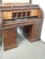 A late Victorian double pedestal dome top desk with pull-out slide. COLLECT ONLY.