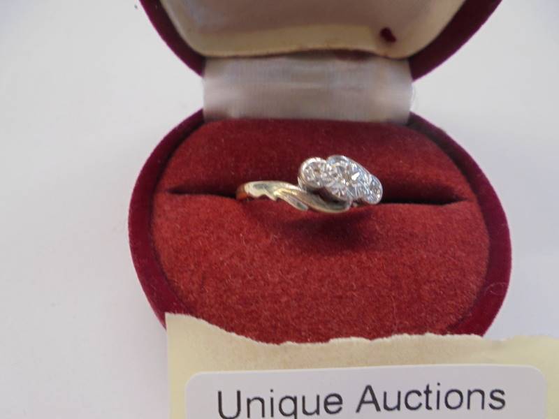 A circa 1940's diamond three stone ring in a twist design, stamped 18ct/Platinum, size O, 2.8 grams - Image 2 of 2