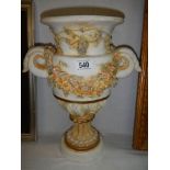 A Grecian style ceramic urn.