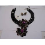 A Butler & Wilson statement necklace and earrings, (flowers 9cm across).