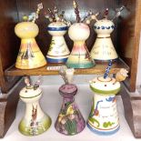 7 Torquay ware hat pin stands