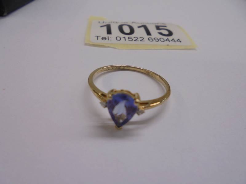 An 18ct gold pear shaped sapphire and diamond ring, size P, 1.38 grams. - Image 2 of 2