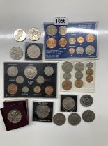 A collection of coins, Including a Churchill crown set