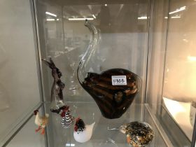 An art glass elephant, rabbit , 3 chicks and a birds head.