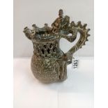 A Studio pottery puzzle jug with dragon handle. Height 22cm