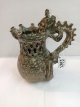 A Studio pottery puzzle jug with dragon handle. Height 22cm